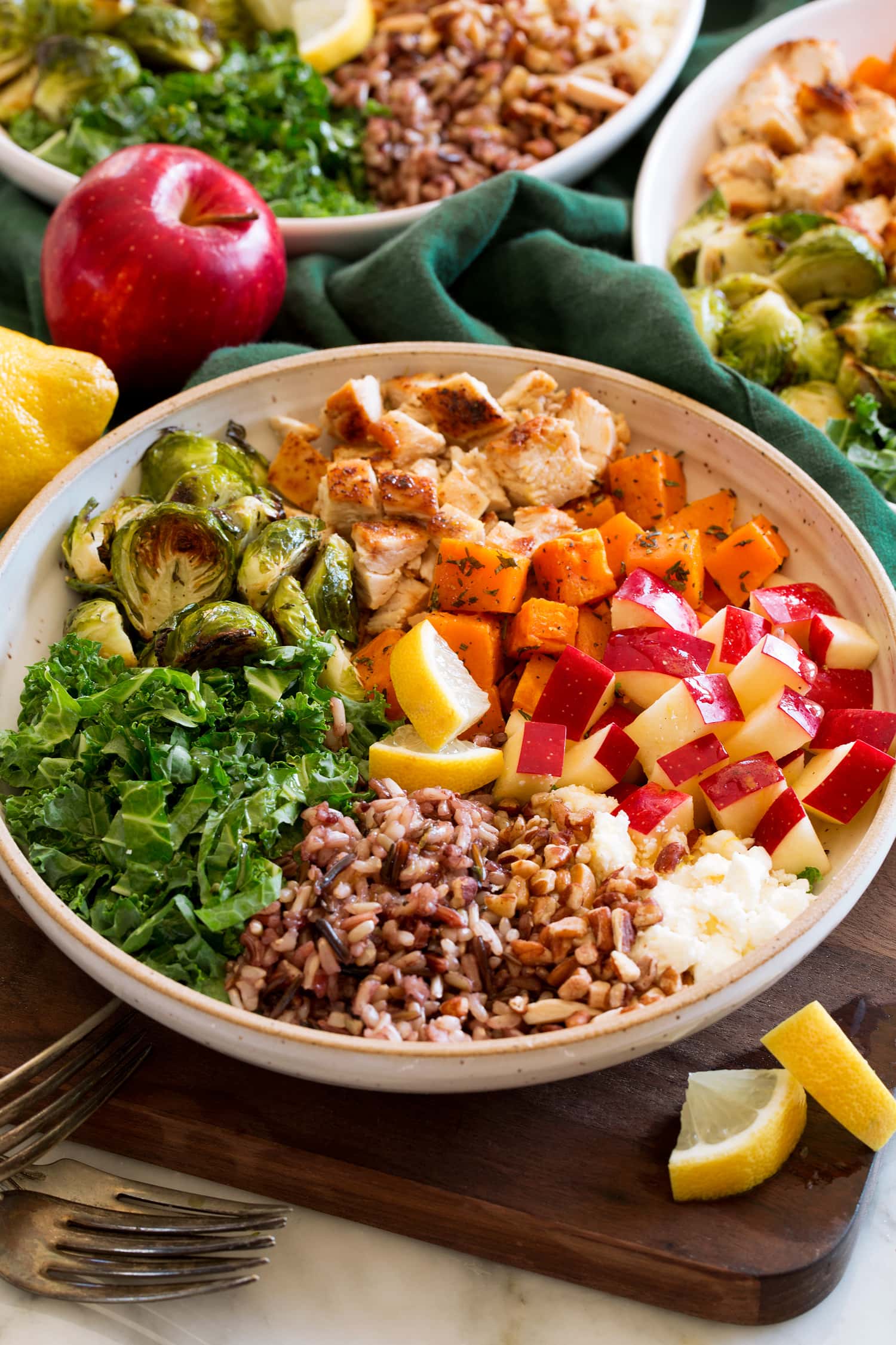 Sweet green harvest bowl copycat single serving with sweet potatoes, kale, apples, chicken, wild rice, goat cheese, and lemon dressing.