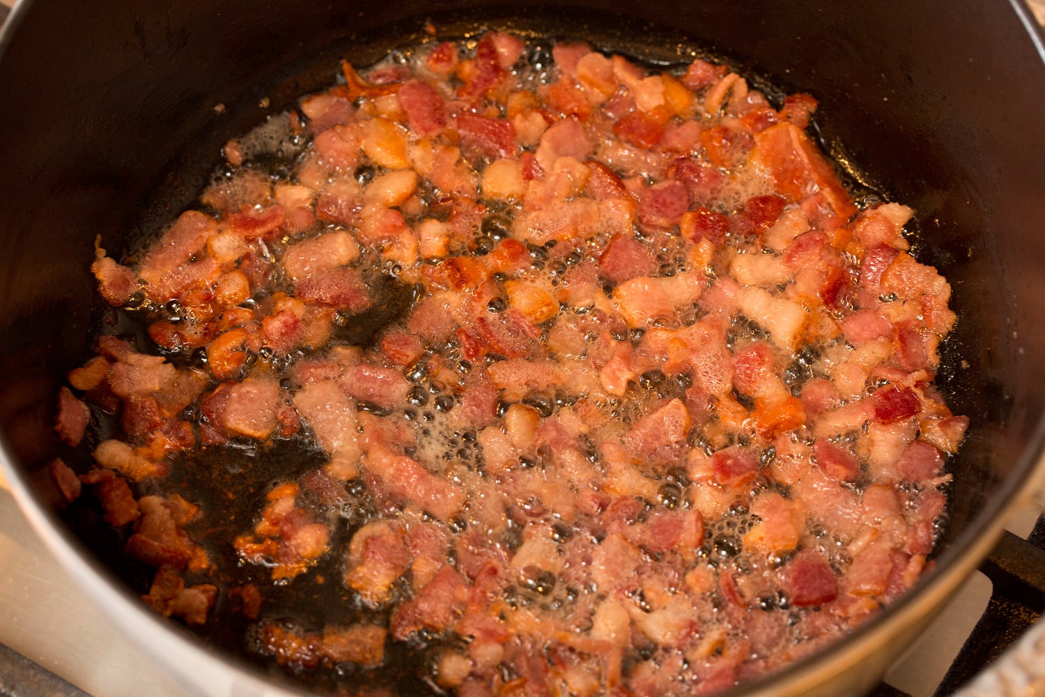 Cooked bacon in pot.