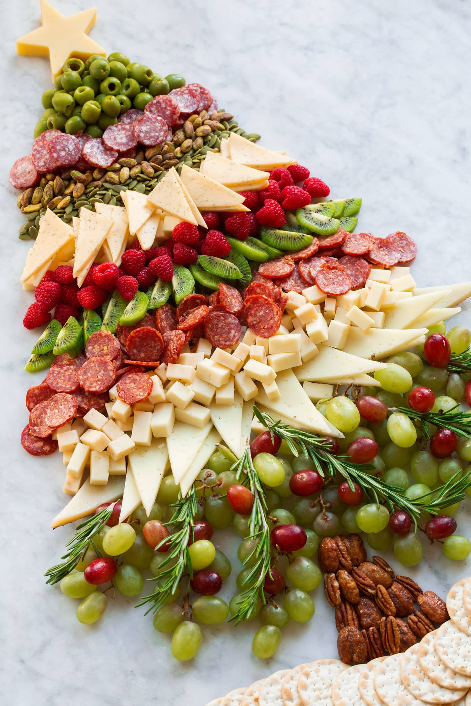 Extra large Christmas tree charcuterie board shown from the side.