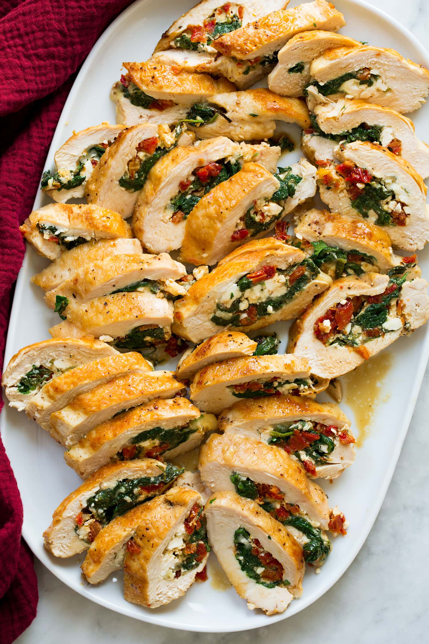 Stuffed chicken breasts with spinach, feta, mozzarella, and sun dried tomatoes.