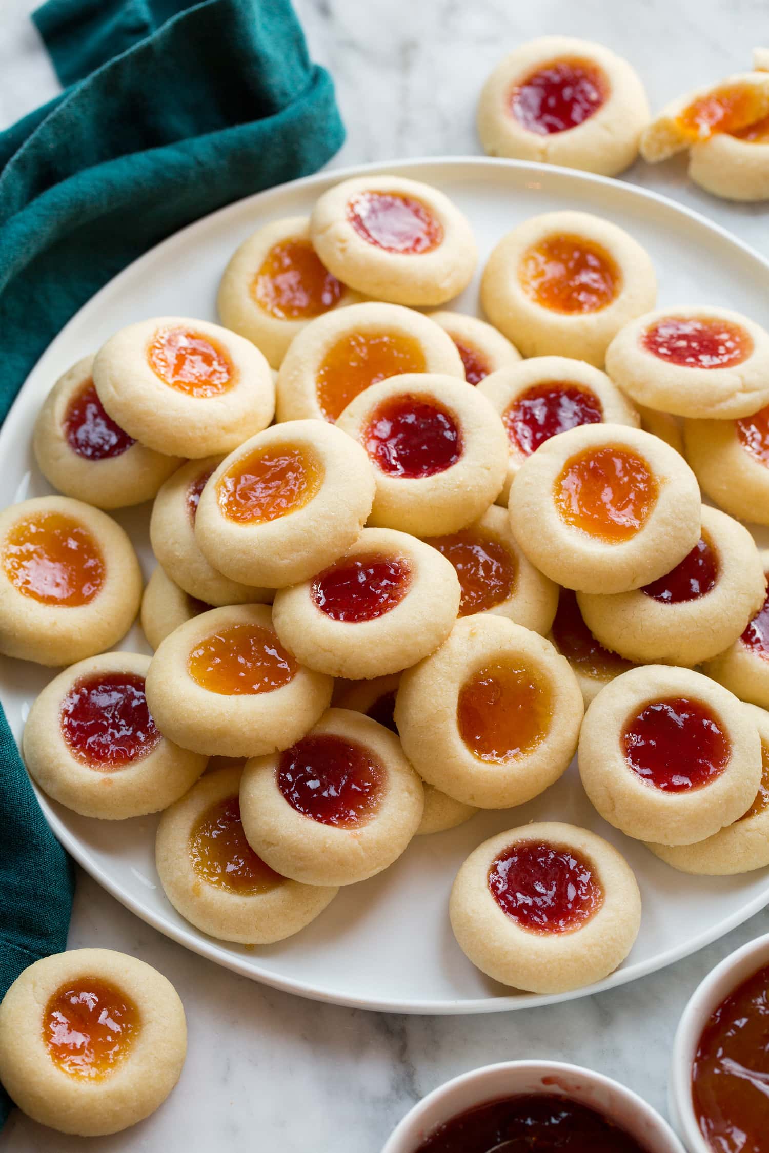 Homemade Thumbprint Cookies filled with apricot and strawberry jam.