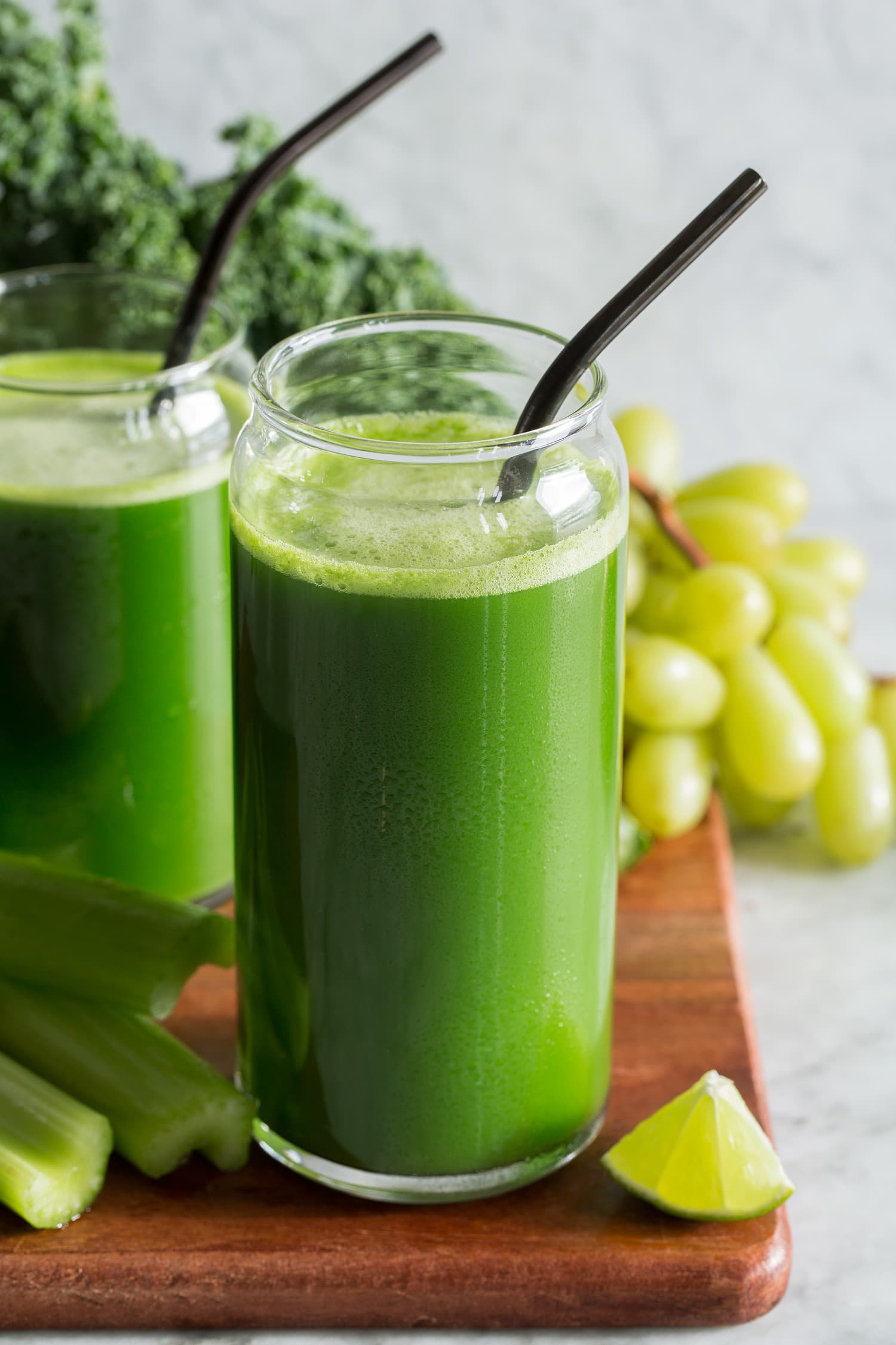 Close up photo of fresh homemade green juice with vegetables and fruit.