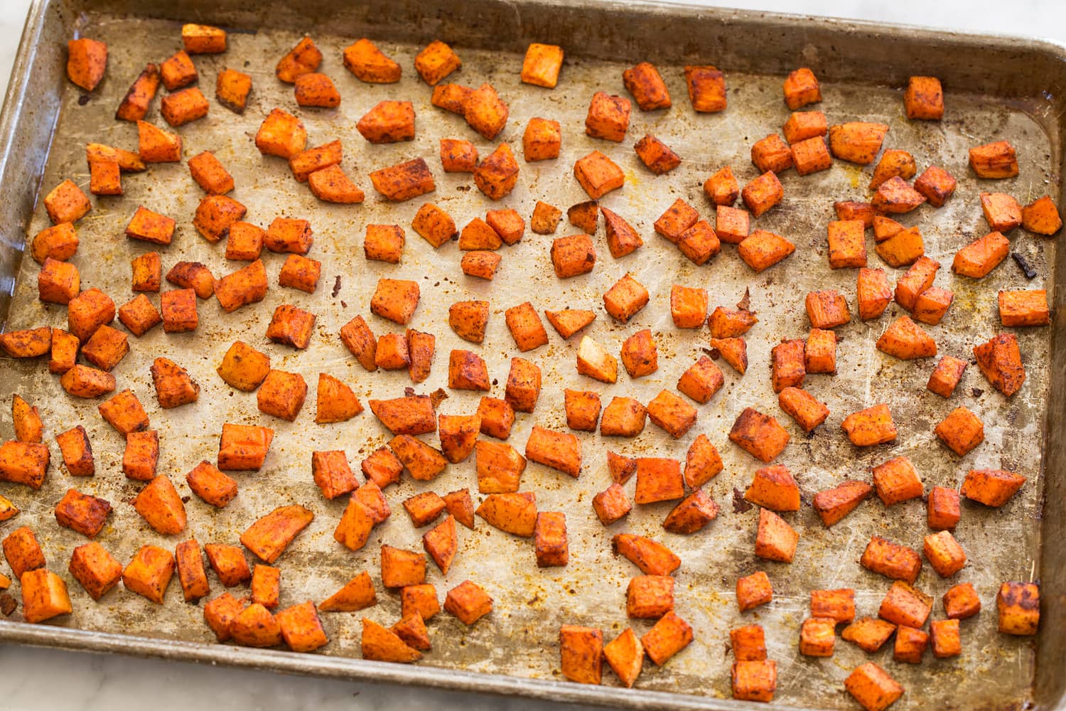 Roasted sweet potatoes on baking sheet.