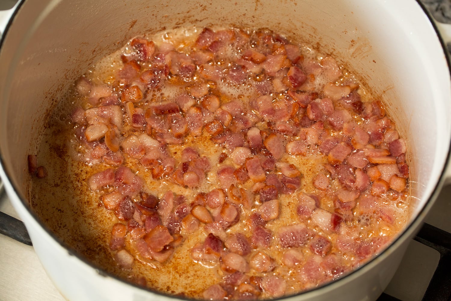 Bacon after cooking in pot.