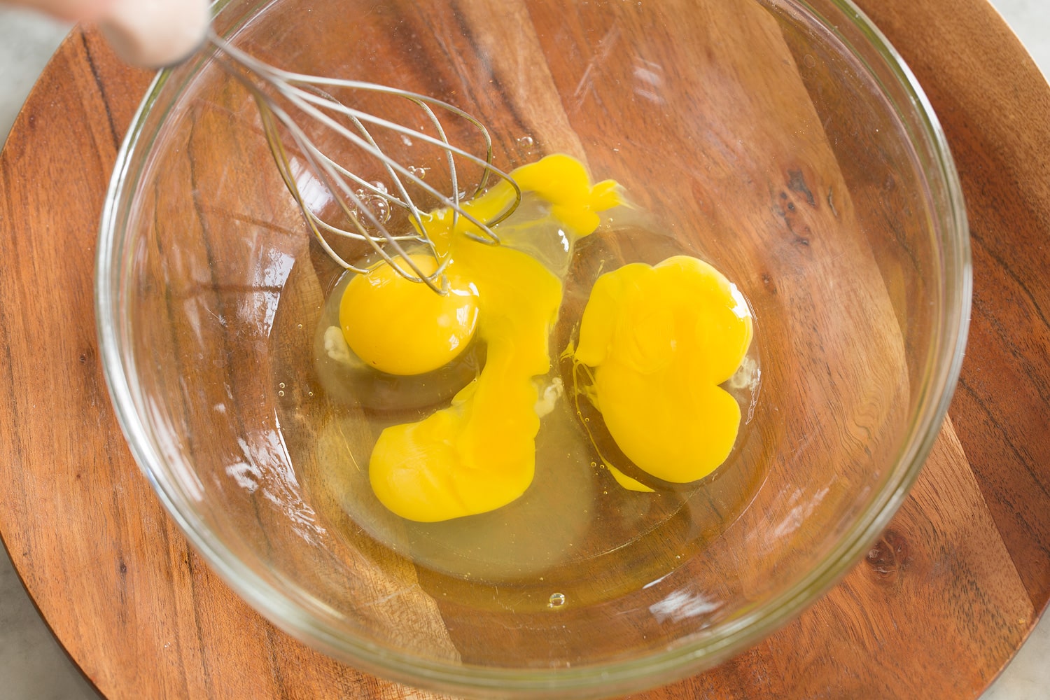 Whisking eggs in mixing bowl.