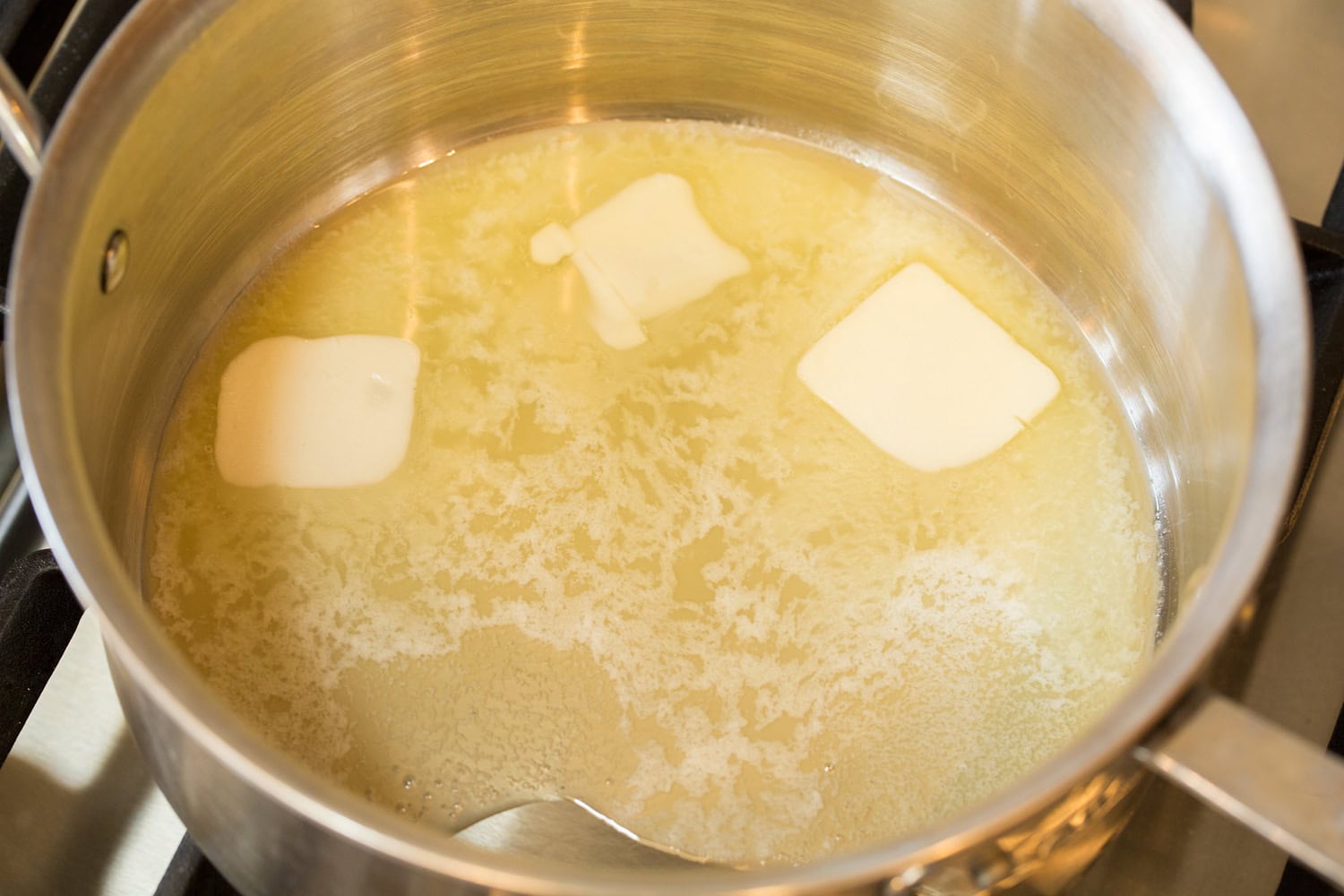 Melted butter in saucepan.