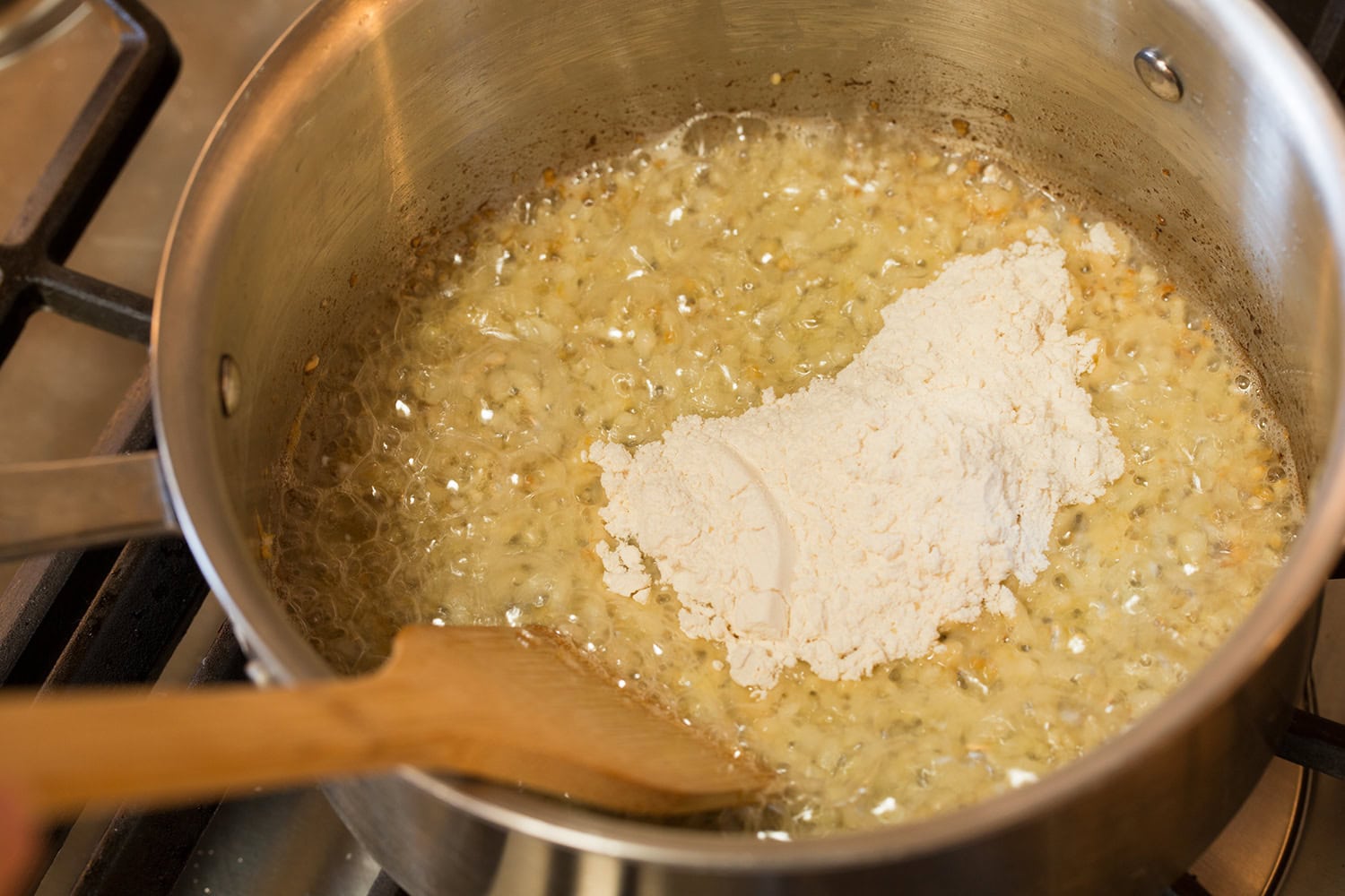 Flour added to sauteed onions in butter.
