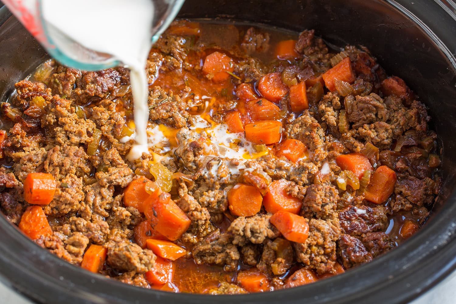 Tapioca starch slurry added to slow cooker after cooking to thicken.