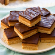 Stacked pyramid of millionaire's shortbread bars. - 1