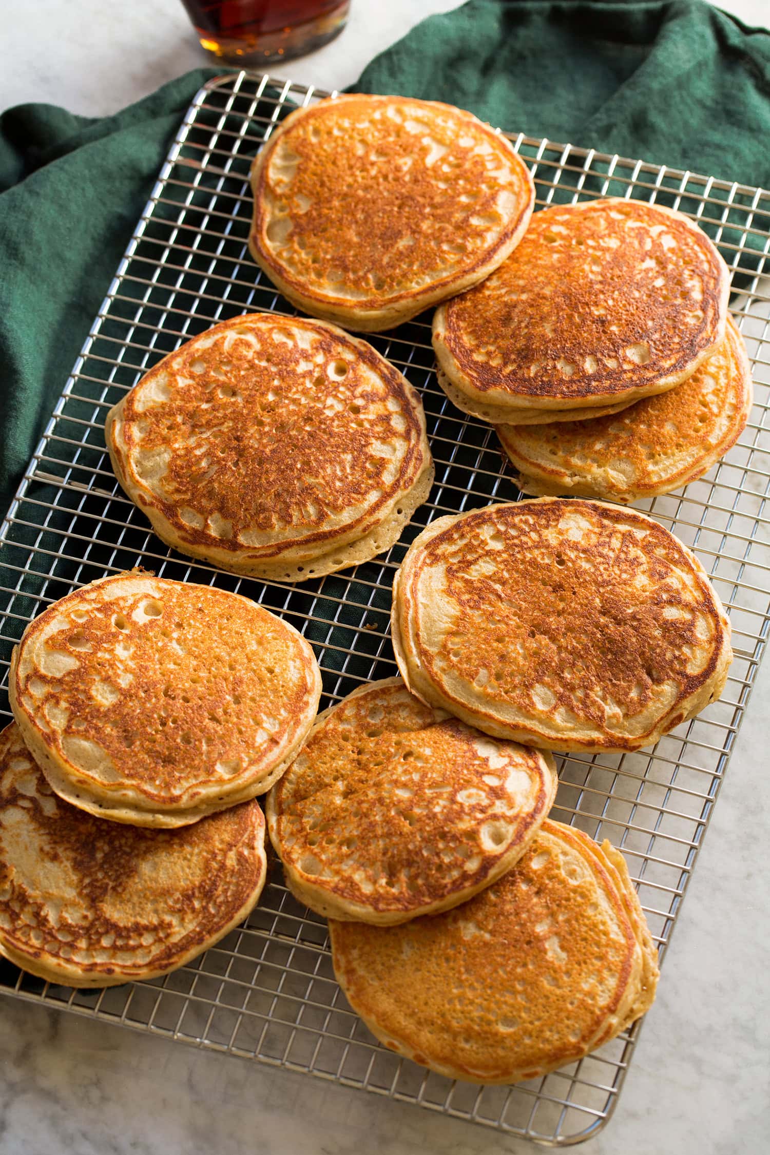 Homemade protein pancakes on a wire cooling rack.