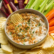 Platter with veggies, potato chips and french onion dip. - 1