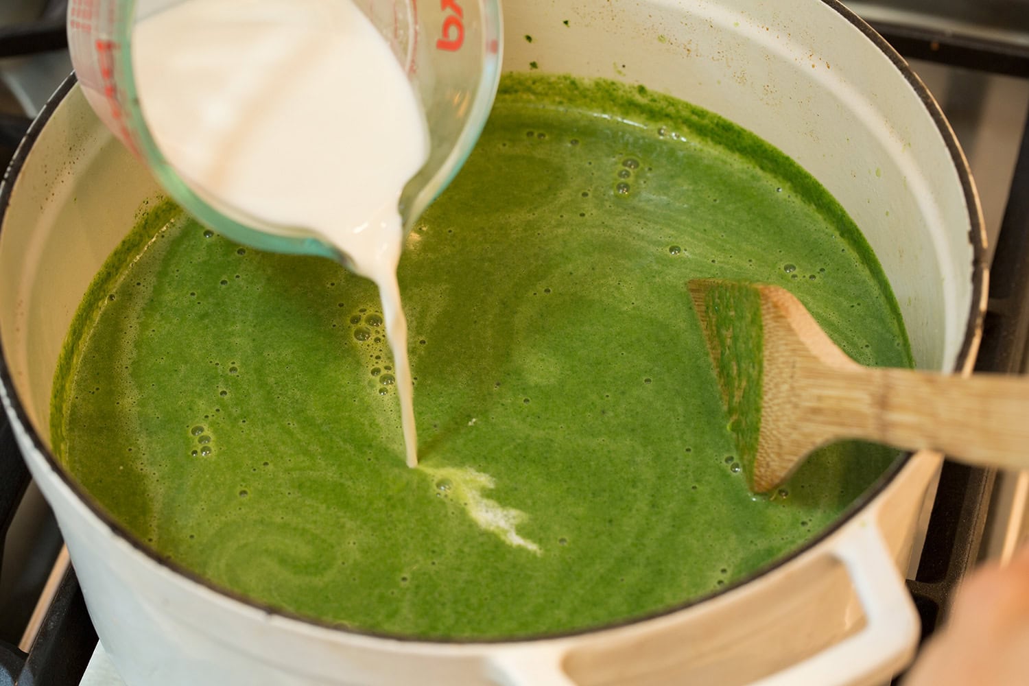 Spinach Soup Half and half cream added to spinach soup mixture.