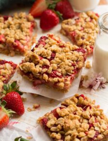 Close up photo of stacked strawberry oatmeal breakfast bars.