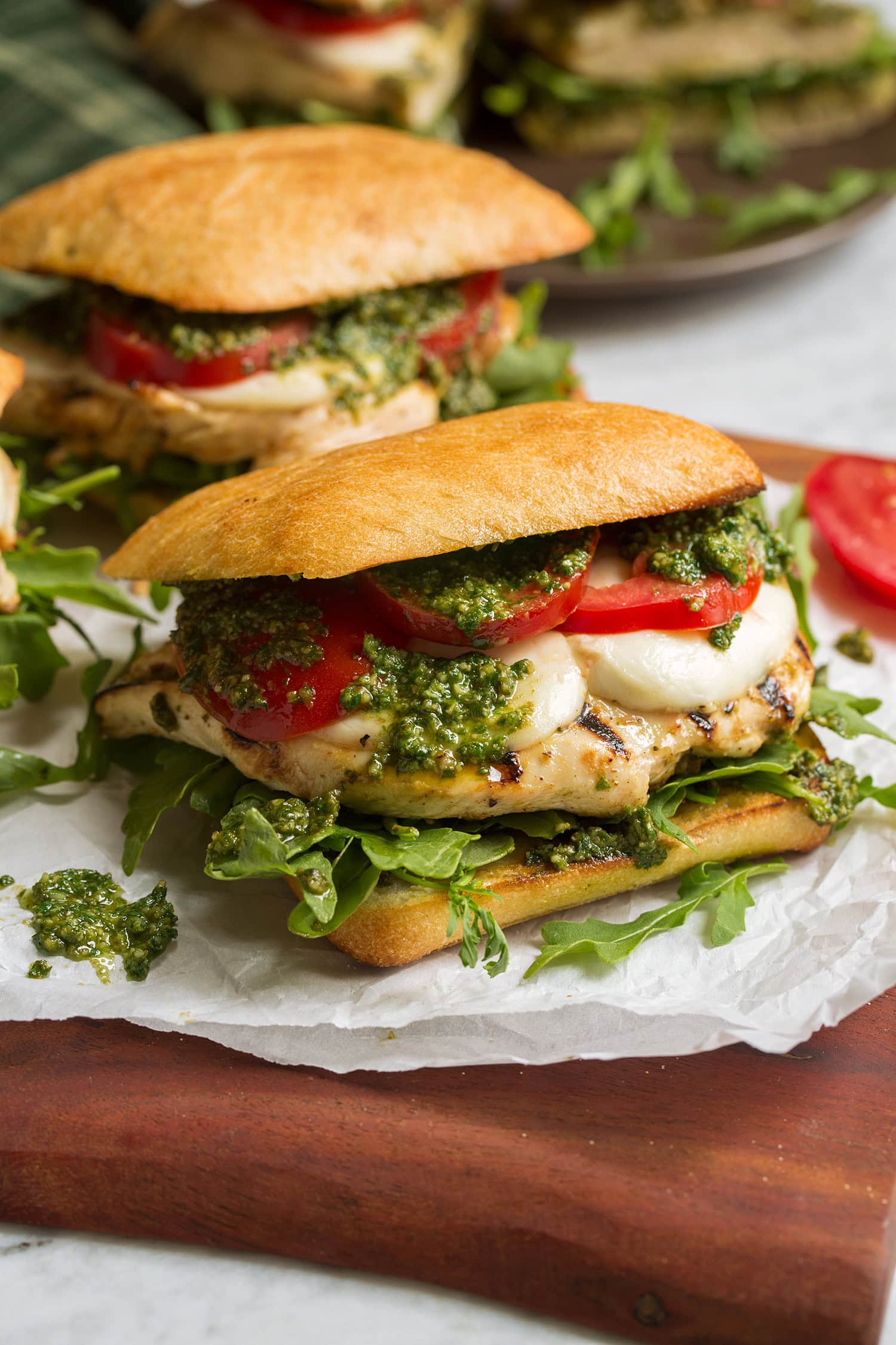 Chicken pesto sandwich on ciabatta bun.