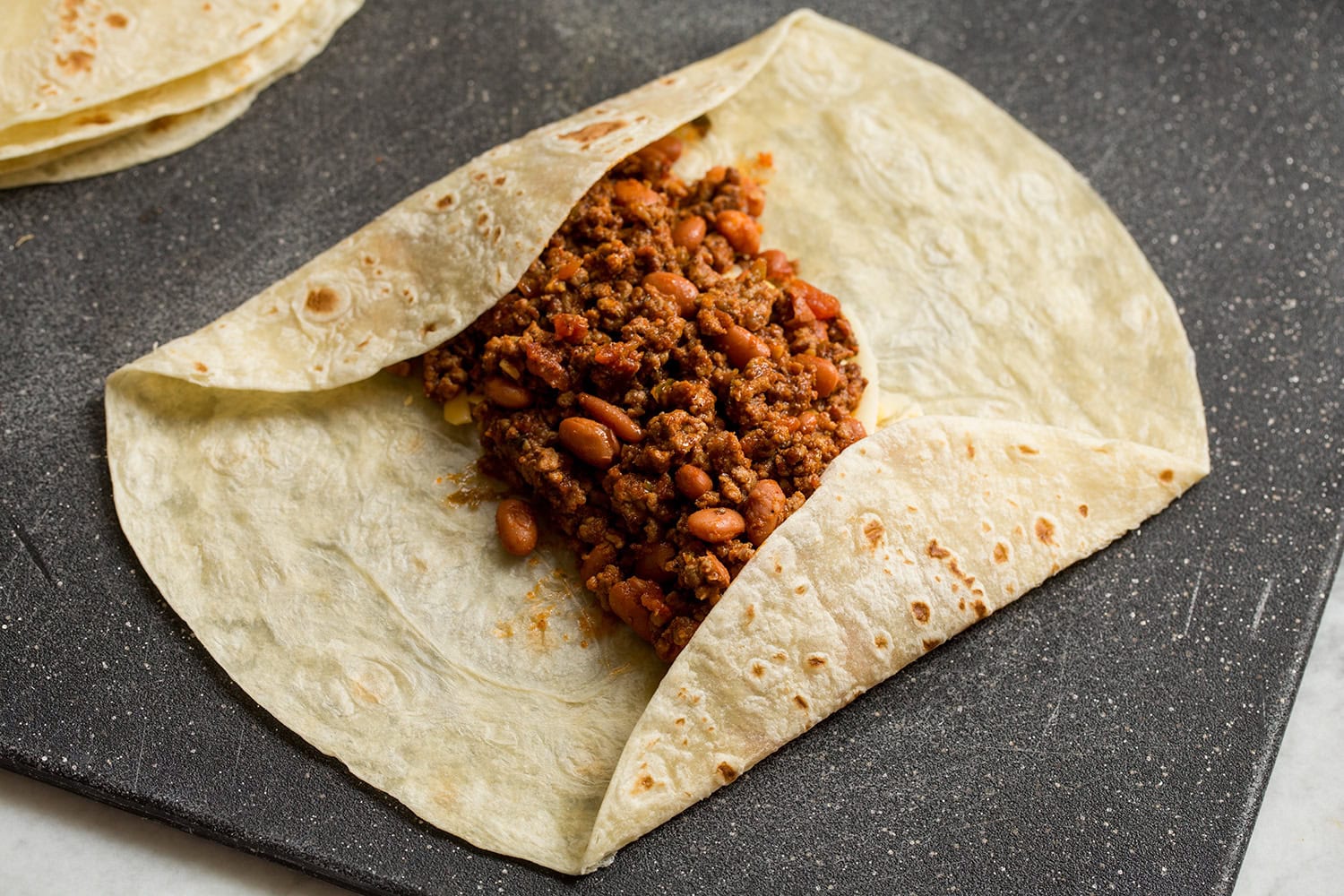 Easy Beef Burritos Showing how to wrap a burrito.