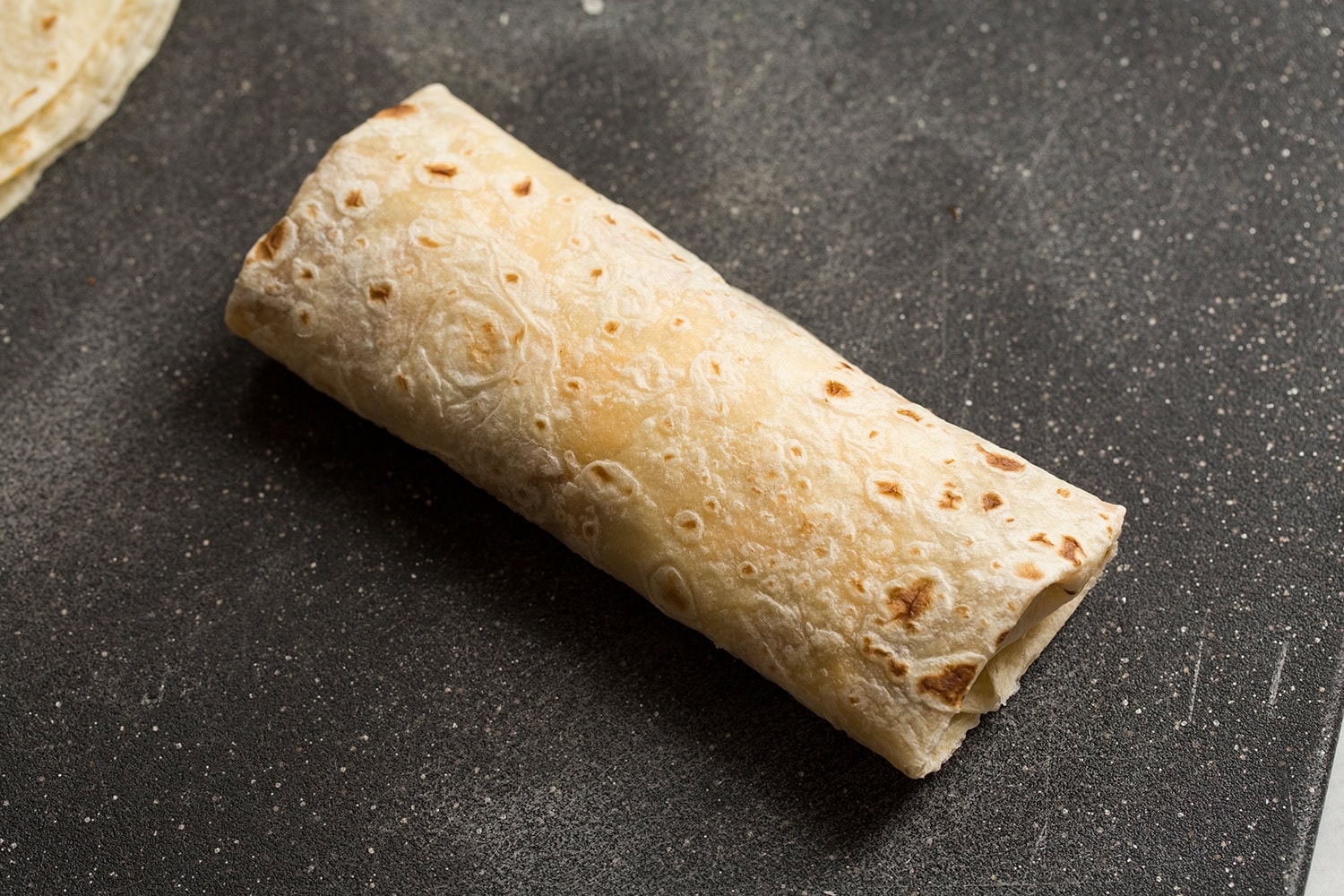 Easy Beef Burritos Completely assembled burrito shown.