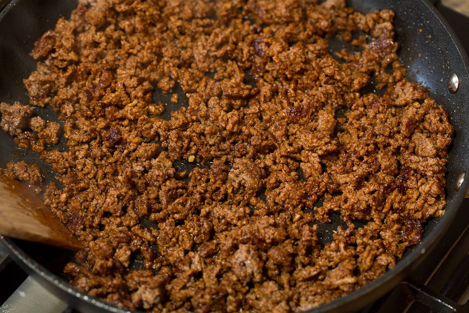 Finished seasoned and cooked fajita ground beef in skillet.