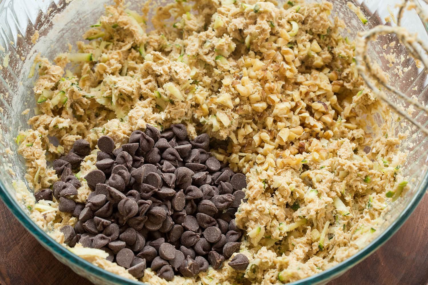 Chocolate chips and walnuts added to cookie dough mixture.